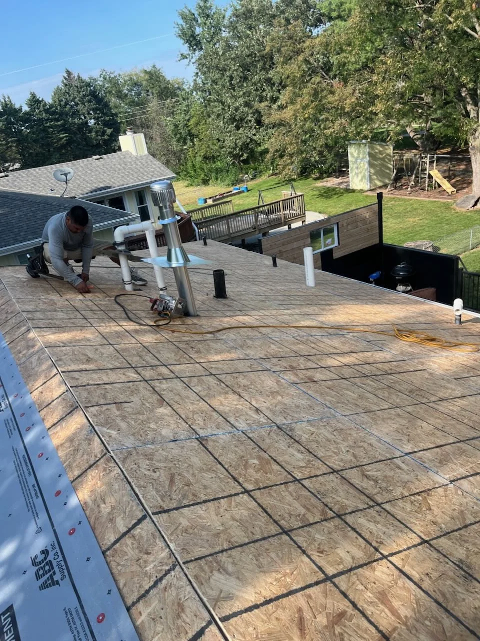 Professional roofing installation by Collis Construction team